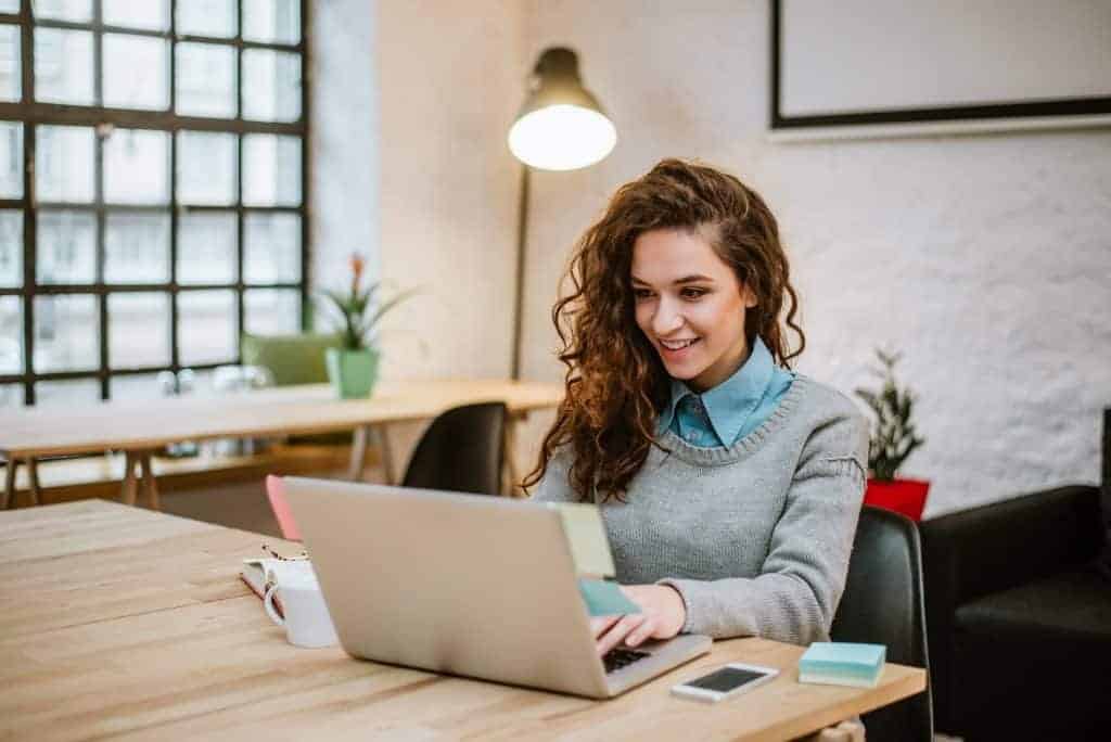 successful-young-woman-modern-office-working-laptop-1024x684-1